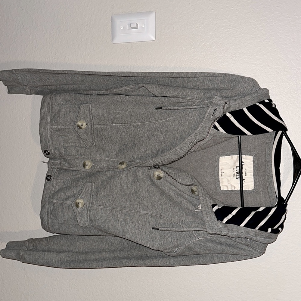 Grey jacket with navy blue lined hood